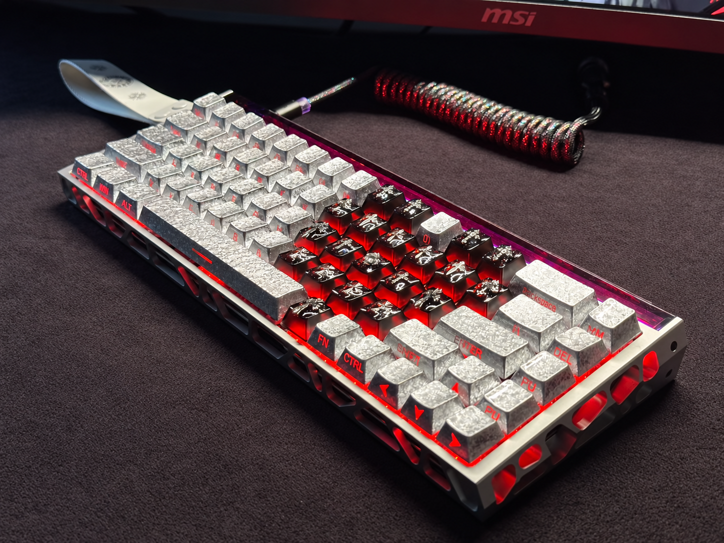 Custom keyboard with metallic keycaps and red lighting