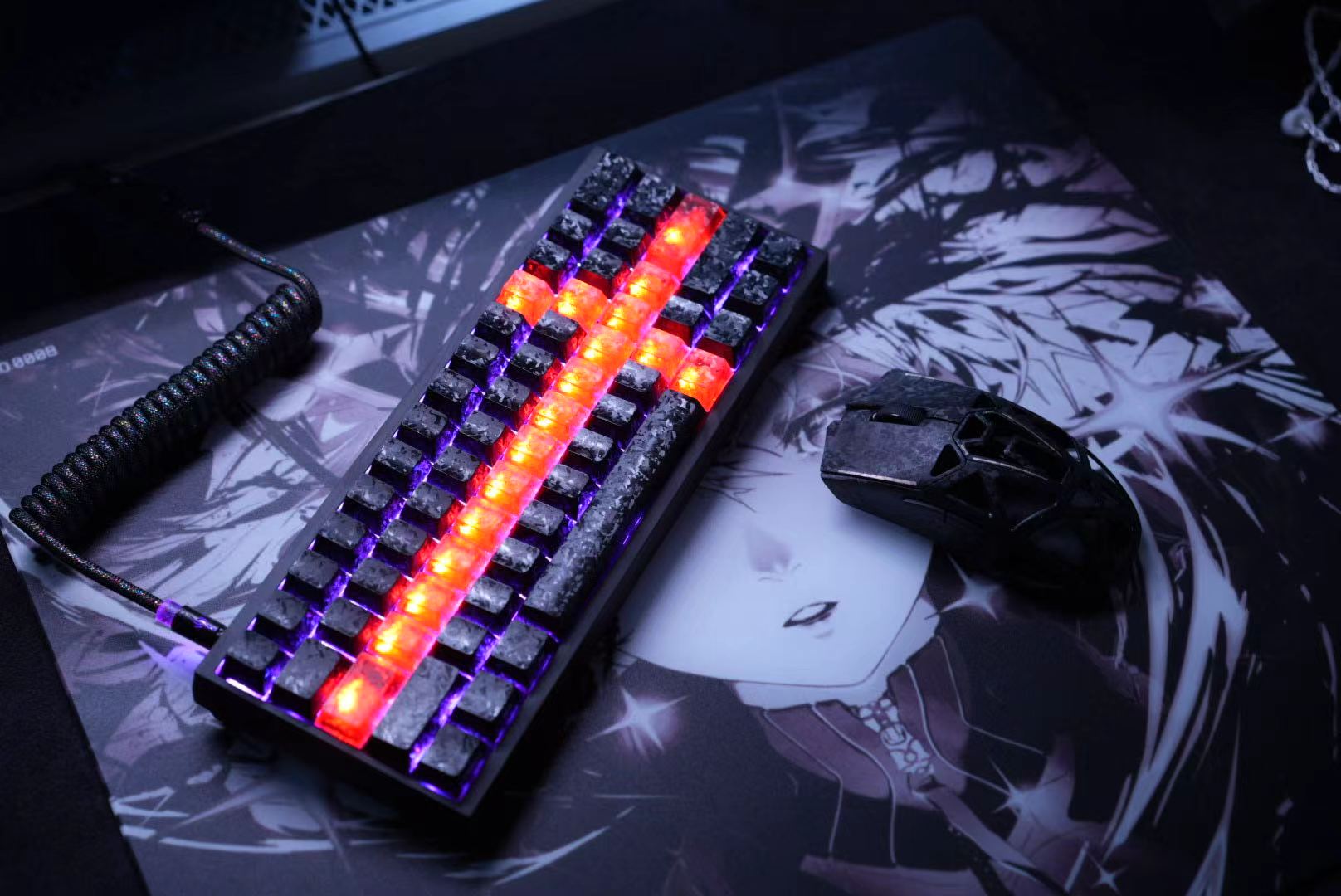 Dark custom keyboard with RGB lighting and matching mouse