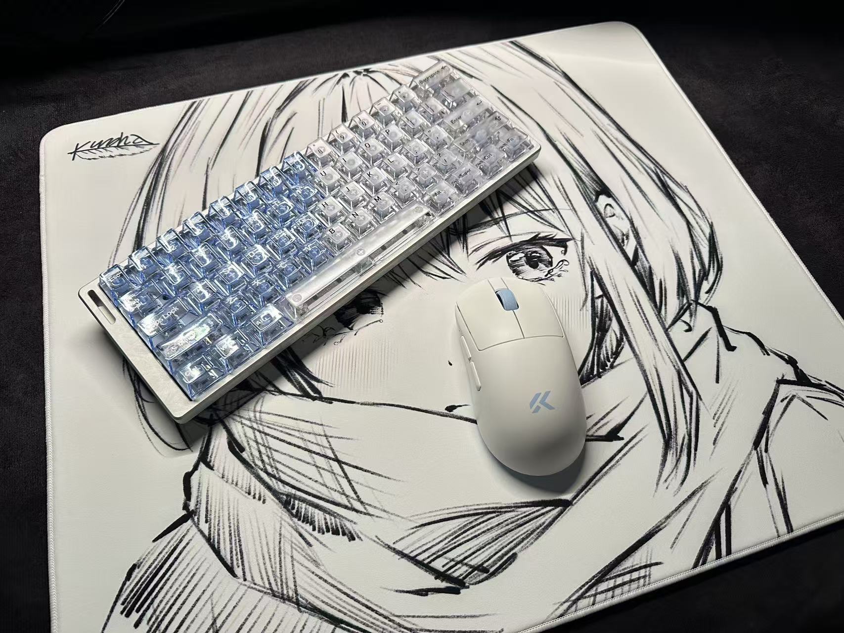 Transparent keyboard and mouse on a desk mat