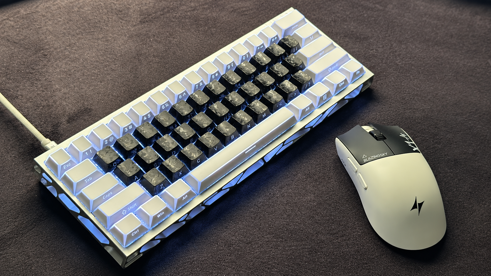 Compact white keyboard with black keycaps and matching mouse